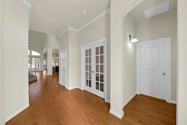 corridor with crown molding and wood-type flooring