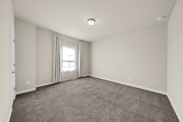 unfurnished room featuring carpet floors