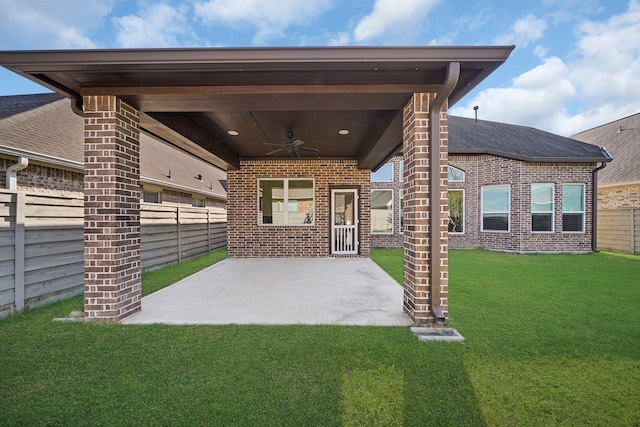 exterior space featuring ceiling fan, a lawn, and a patio area