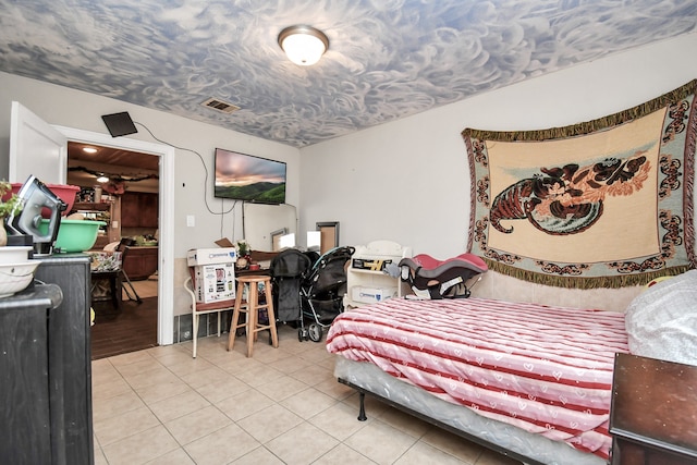 bedroom with tile patterned floors