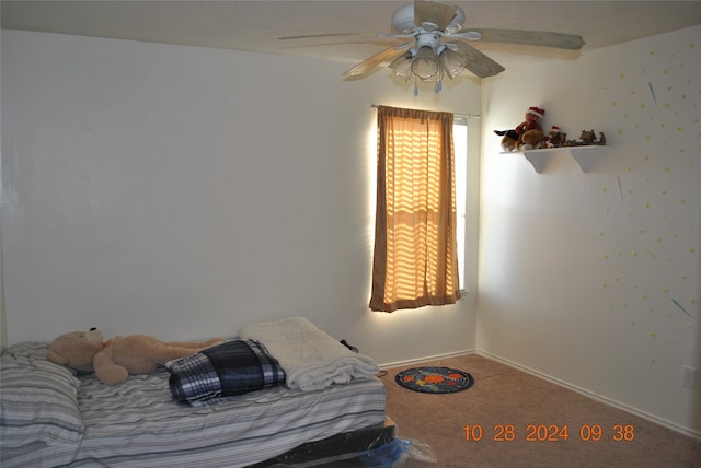 carpeted bedroom featuring ceiling fan