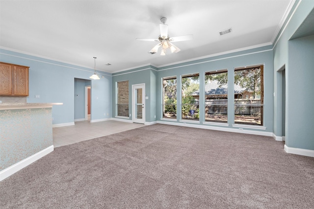 unfurnished living room featuring ceiling fan, light colored carpet, and ornamental molding