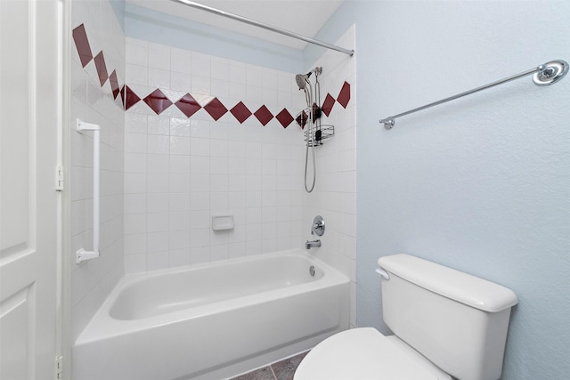 bathroom with toilet and bathtub / shower combination