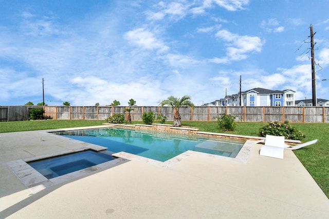 view of swimming pool with an in ground hot tub and a yard