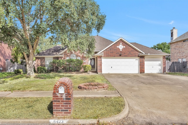 view of front of house with a garage and a front lawn