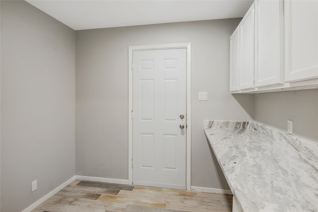 laundry area featuring light hardwood / wood-style floors