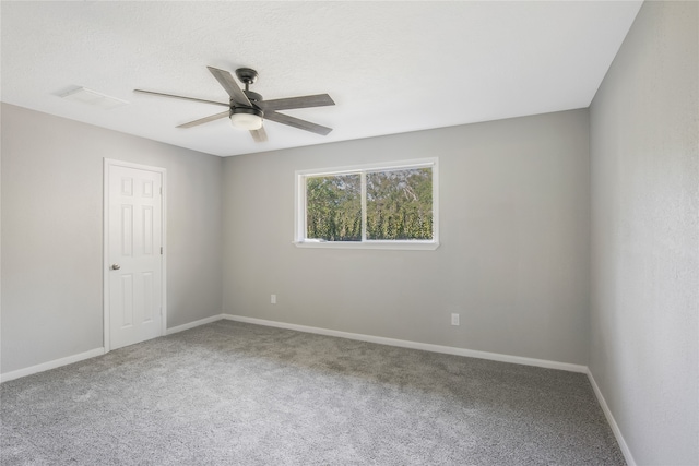 unfurnished room with carpet and ceiling fan