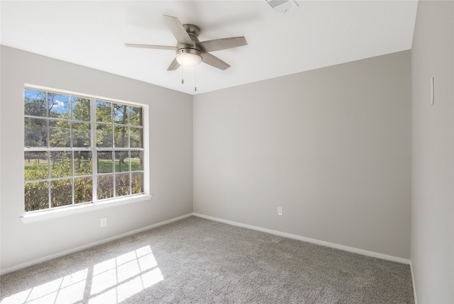 carpeted empty room with ceiling fan