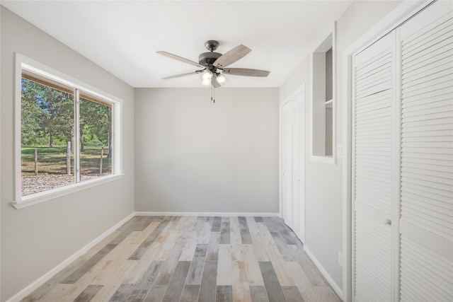 hallway featuring light hardwood / wood-style floors and plenty of natural light