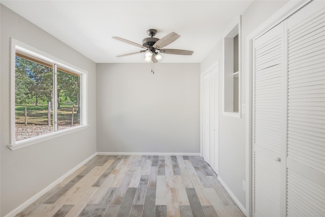 interior space with light wood-style floors and baseboards