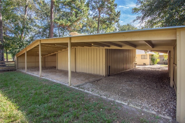 exterior space featuring fence and an outbuilding