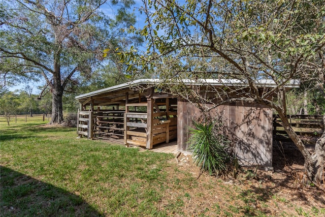 view of outbuilding with a lawn