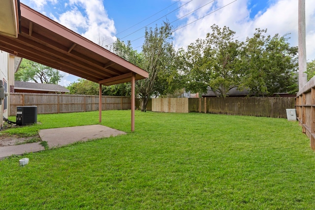 view of yard featuring a patio and central AC unit