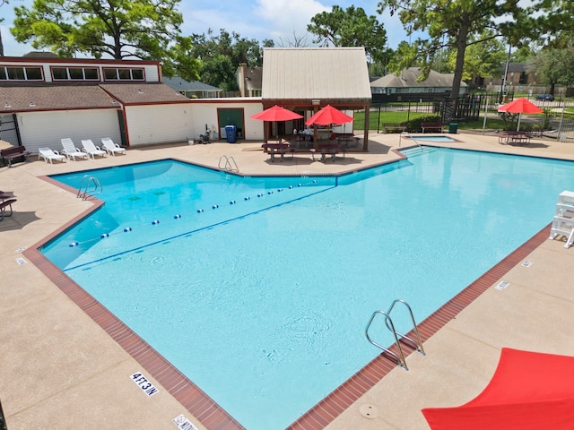 view of swimming pool with a patio area