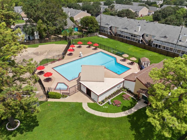 view of swimming pool with a lawn and a patio