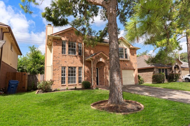 view of front of house featuring a garage and a front yard