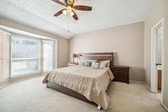 carpeted bedroom featuring ceiling fan, a textured ceiling, and multiple windows