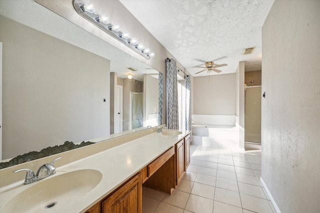 bathroom with tile patterned floors, vanity, shower with separate bathtub, a textured ceiling, and ceiling fan