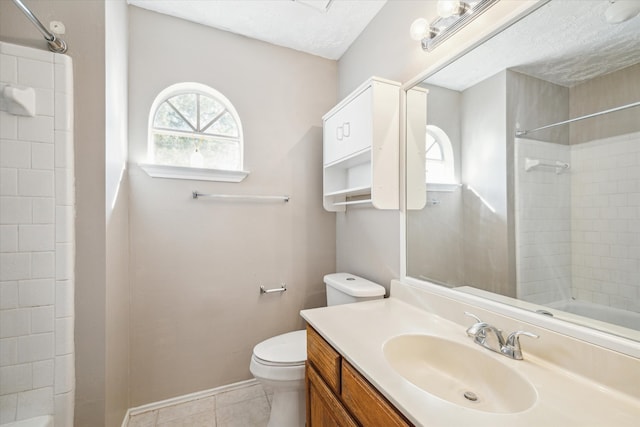 full bathroom featuring a textured ceiling, toilet, vanity, tiled shower / bath combo, and tile patterned floors