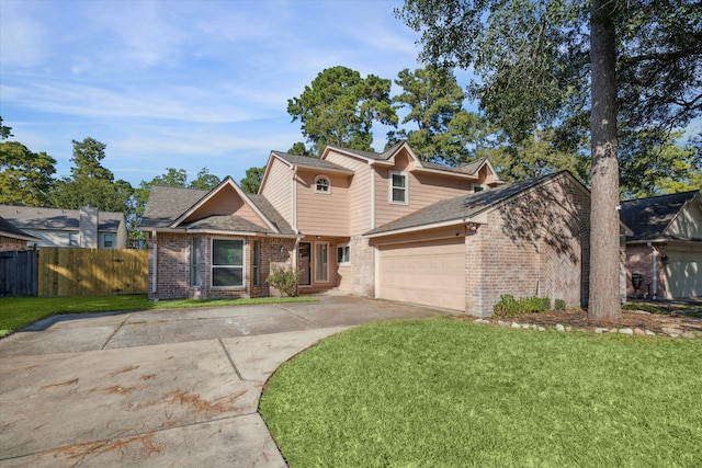 view of front of home featuring a front lawn and a garage