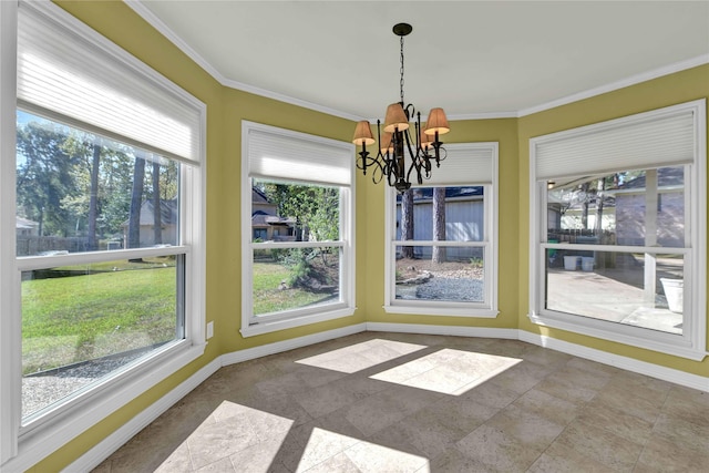 unfurnished dining area featuring baseboards, a chandelier, and crown molding