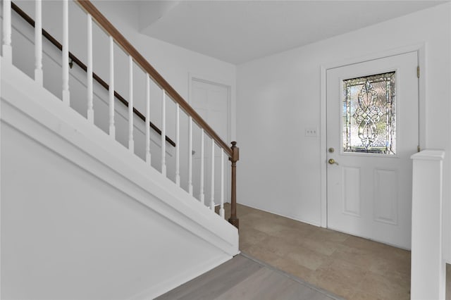 foyer featuring stairs