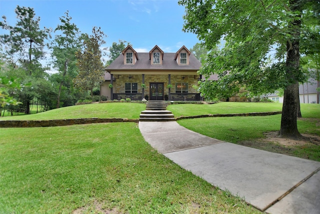 new england style home with a porch and a front lawn