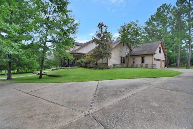 view of front facade with a front yard and a garage