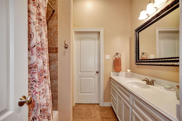 bathroom with vanity, shower / bath combo with shower curtain, and tile patterned floors