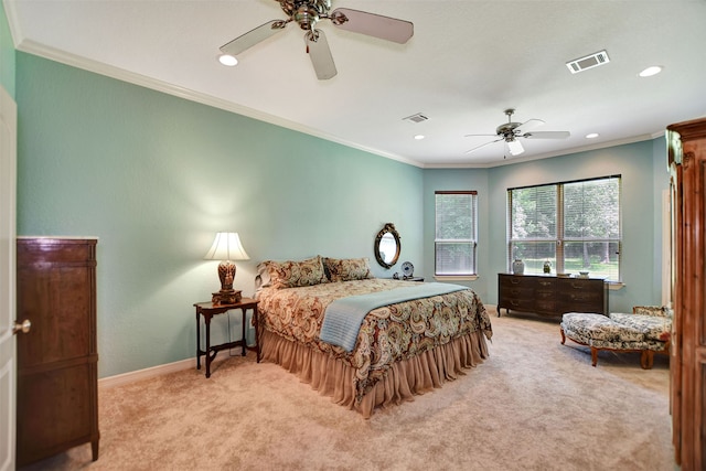 bedroom with ceiling fan, crown molding, and light colored carpet