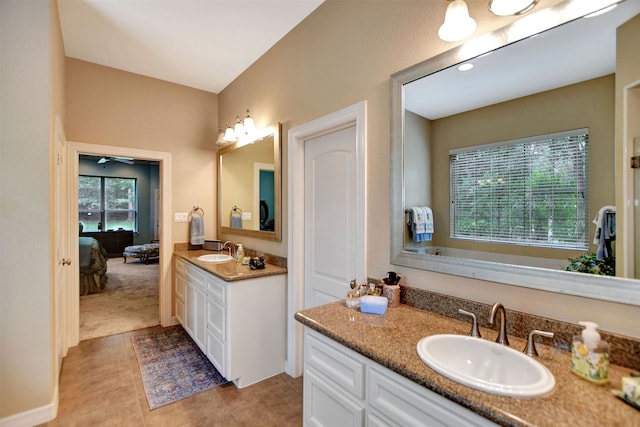 bathroom featuring vanity, ceiling fan, and tile patterned flooring