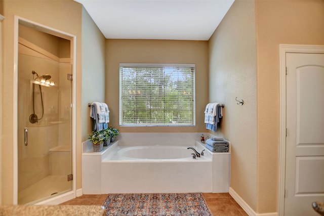 bathroom featuring tile patterned floors and plus walk in shower