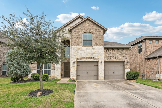 view of front of property featuring a front lawn and a garage