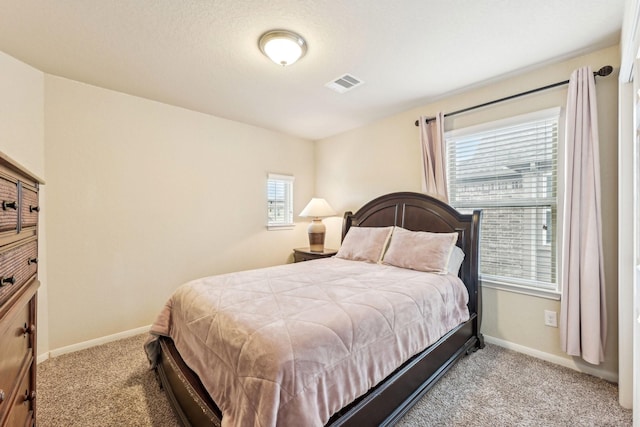 bedroom with light carpet