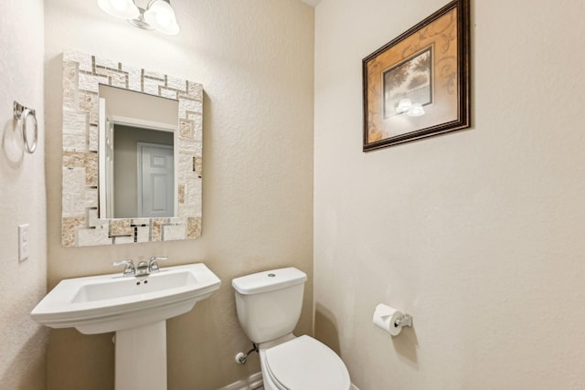 bathroom with sink and toilet