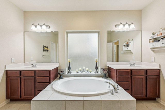 bathroom featuring vanity, tile patterned floors, and a relaxing tiled tub