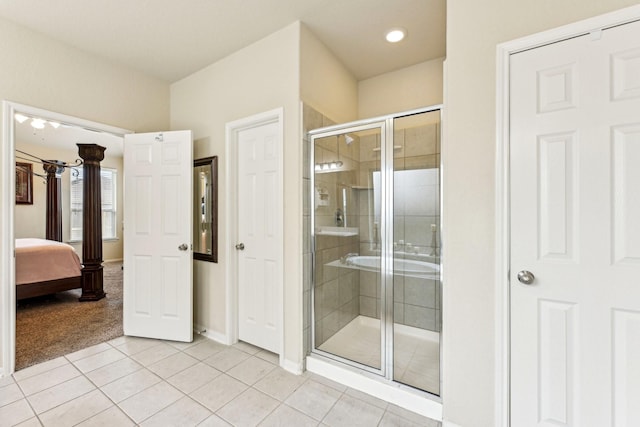 bathroom featuring an enclosed shower and tile patterned flooring