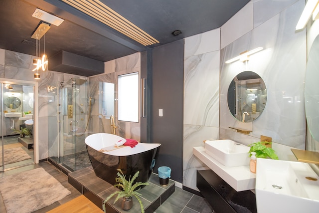 bathroom with vanity, independent shower and bath, and wood-type flooring