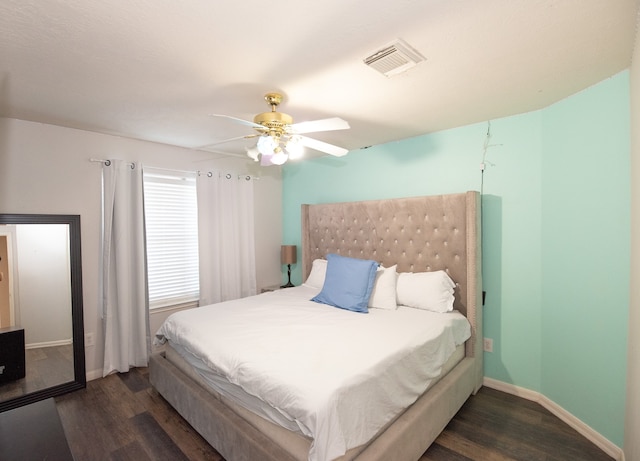 bedroom featuring dark wood-type flooring and ceiling fan