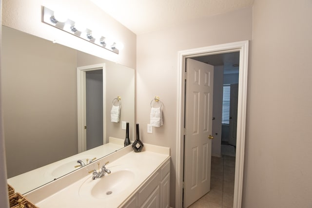 bathroom featuring vanity and tile patterned flooring