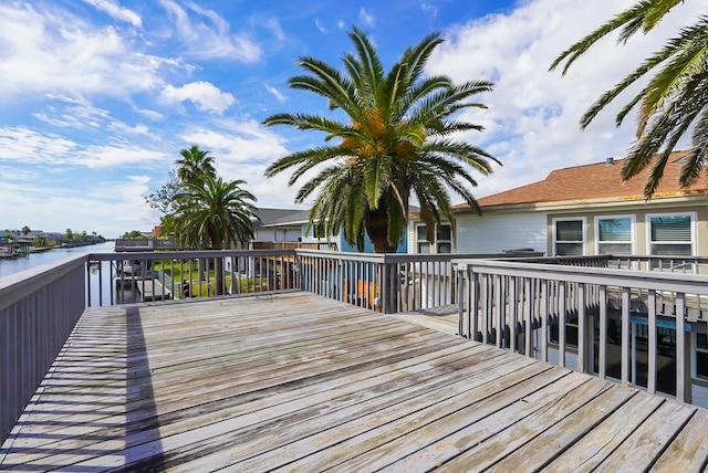 wooden terrace with a water view