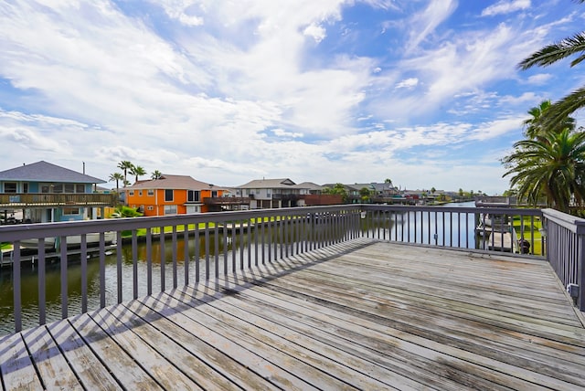 wooden deck with a water view