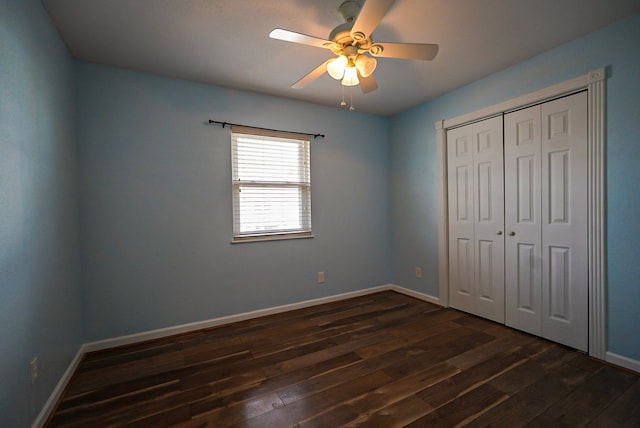 unfurnished bedroom with a closet, ceiling fan, and dark hardwood / wood-style floors