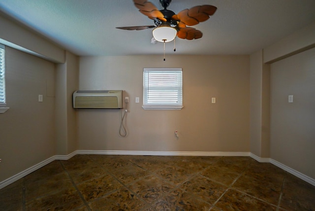 unfurnished room with ceiling fan and a wall mounted air conditioner