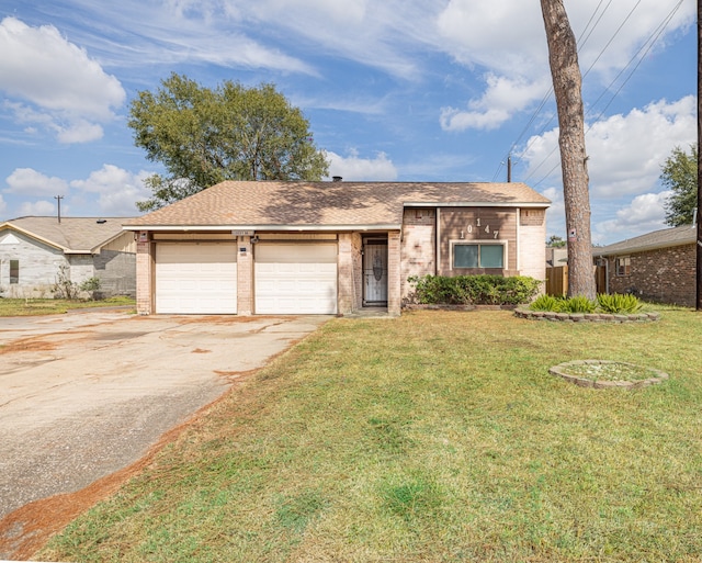 ranch-style house with a front yard and a garage