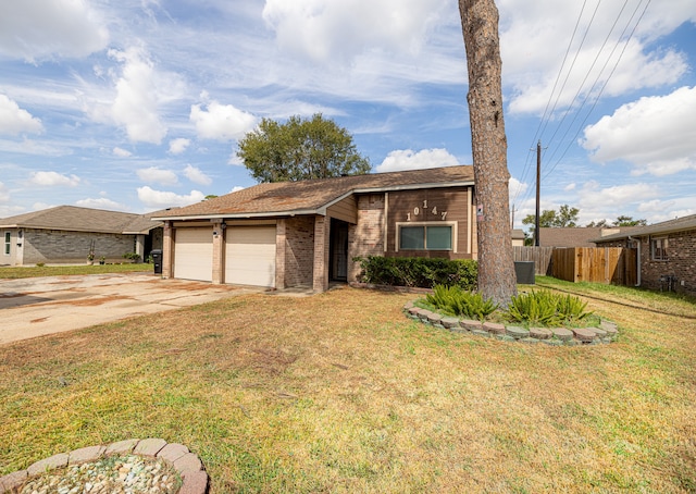 ranch-style house with a garage and a front lawn