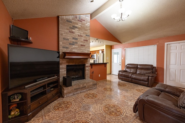 living room featuring vaulted ceiling with beams, a textured ceiling, a fireplace, and tile patterned flooring