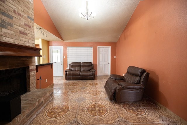 tiled living room featuring a brick fireplace, a textured ceiling, and vaulted ceiling