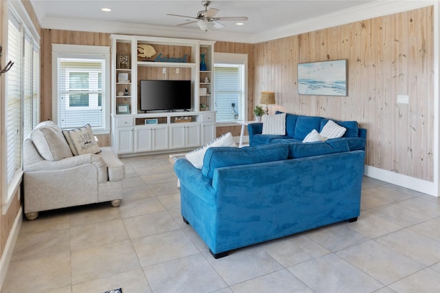 living room with a ceiling fan, baseboards, light tile patterned flooring, recessed lighting, and crown molding