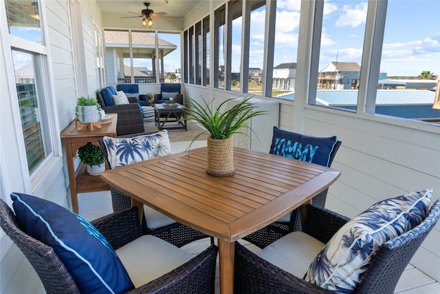 sunroom featuring ceiling fan